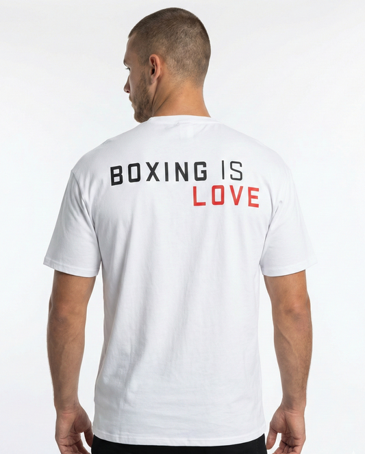Man wearing a white t-shirt with 'Boxing is Love' text on the back against a white background